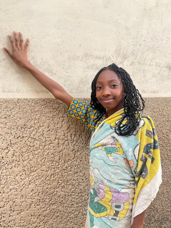 Children play with dogs in Jos residential area