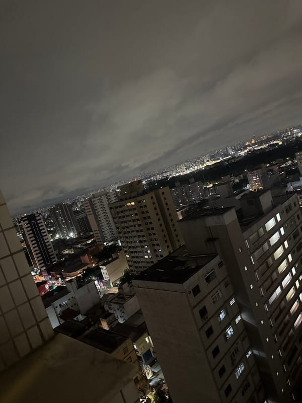 Nighttime aerial views document São Paulo cityscape under cloudy skies