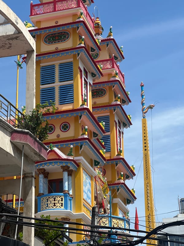 Tourist captures colorful pagoda and beach vendors in Nha Trang