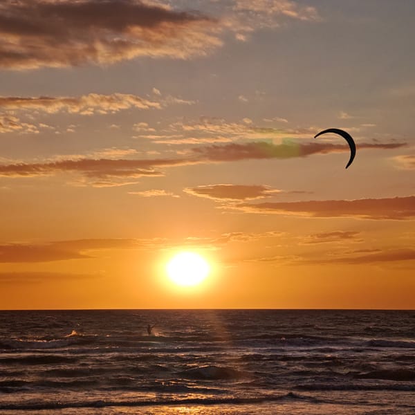 Kitesurfer spotted during ocean sunset on May 26
