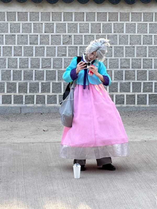 Morning visitors explore Gyeongbokgung Palace in traditional Seoul setting