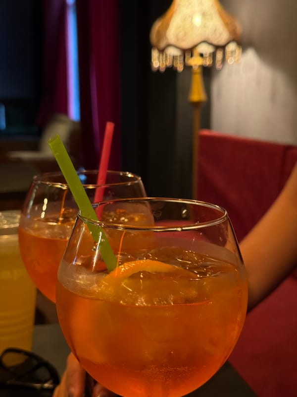 Aperol Spritzes and vintage decor at a Bishkek lounge
