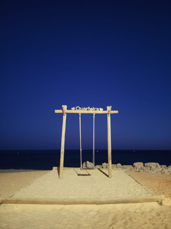 Quarteira beachfront at dusk, summer evening