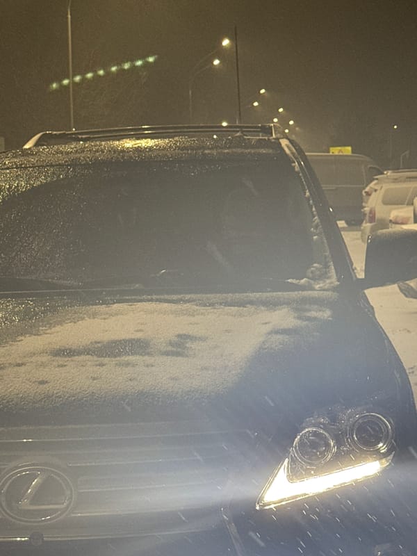 Evening car journey documented through snowy Nizhnevartovsk streets