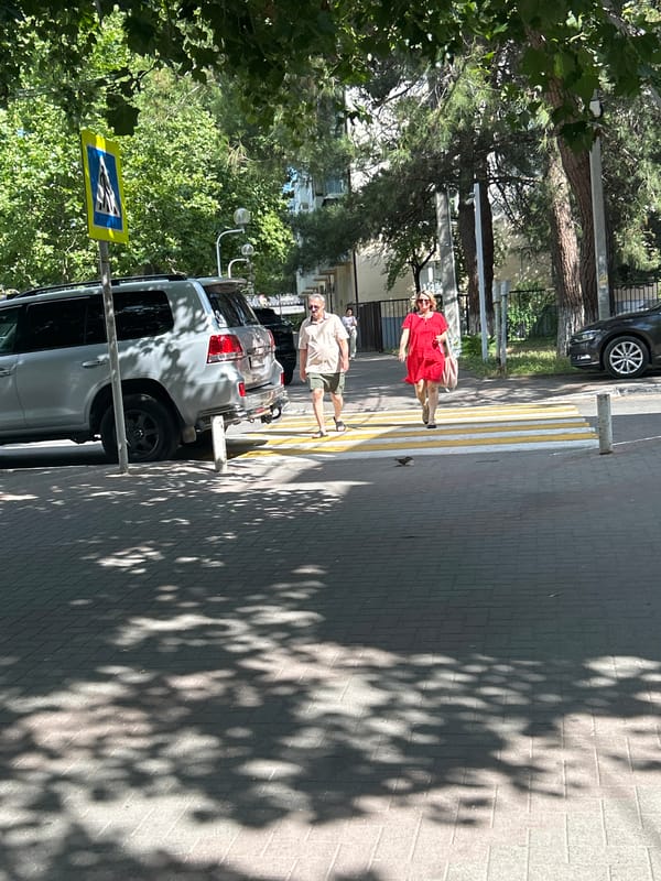 Midday street life along Gelendzhik's sunny summer walkways