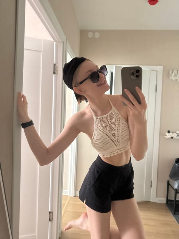 Young woman takes mirror selfies in Perm apartment