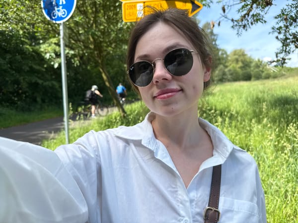 Woman documents sunny morning river walk in Karlovy Vary