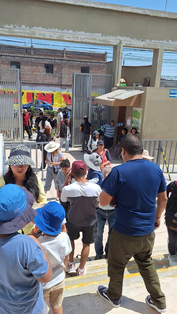Arequipa residents gather around public notices in Mariano Melgar district