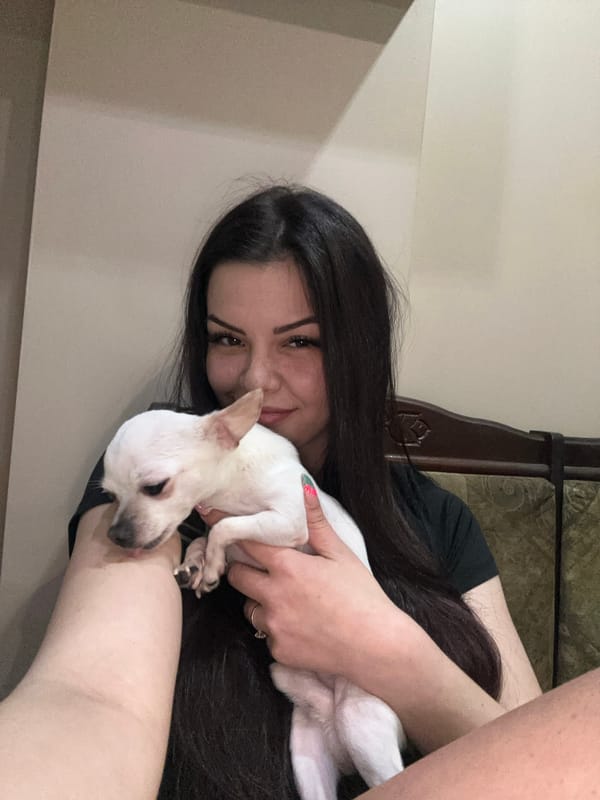Woman Takes Selfie With Dog While Wearing Face Mask