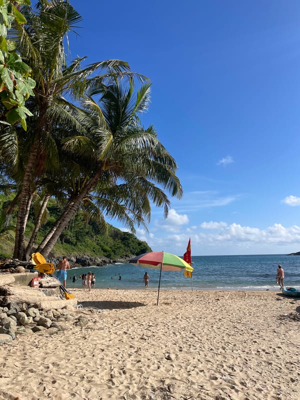 Calm beach day at Rawai's tropical shoreline