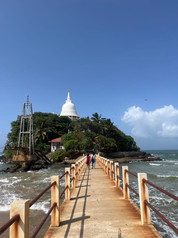 Rusting coastal structures and a stupa island in Walgama