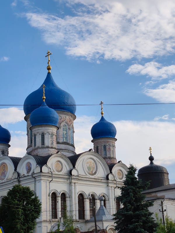 Orthodox churches with blue domes photographed in Rogachovo, Russia