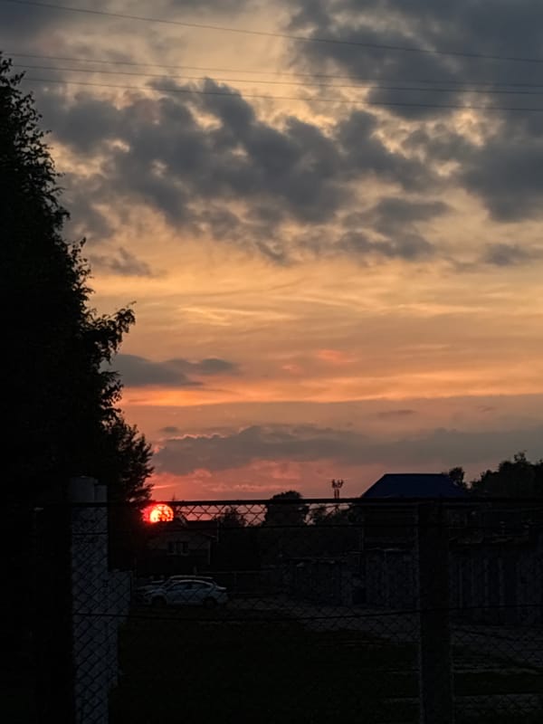 Railway junction and city streets at sunset, dramatic skies