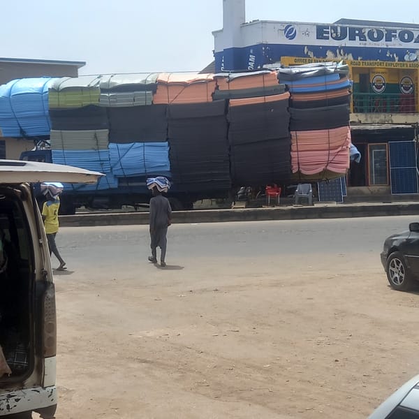 Everyday street life documented in Nigerian towns during midday