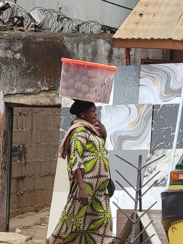 Two women spotted on Maiburiji street carrying items
