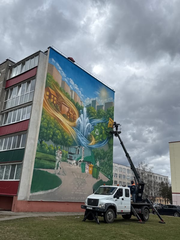 Artist paints cityscape mural on building in Smarhon, Belarus