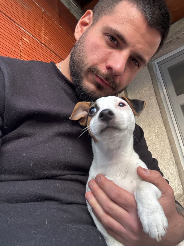 Man holds upside-down dog in Bulgarian village