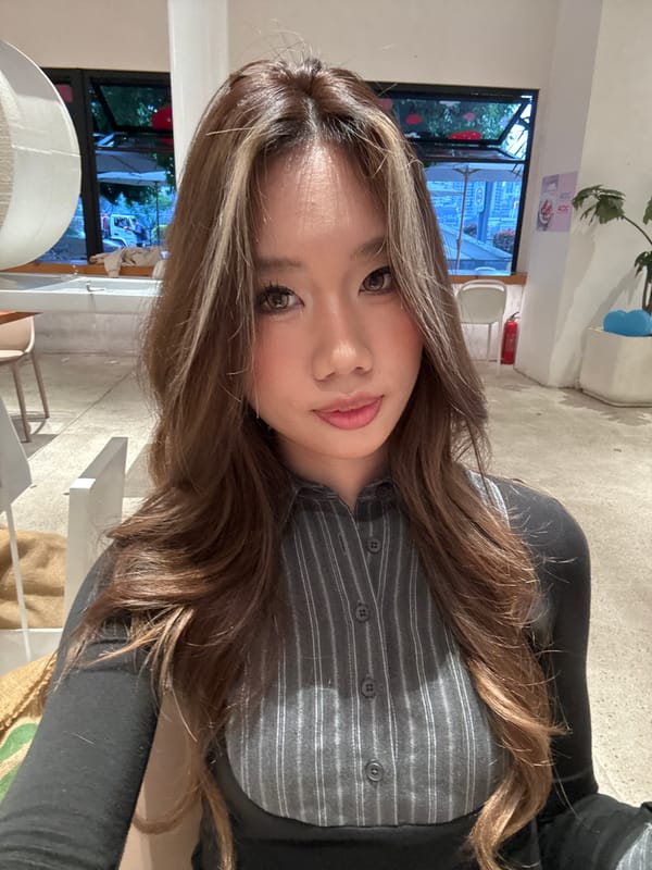 Woman photographs herself at cafe in Jiangbeicheng, China