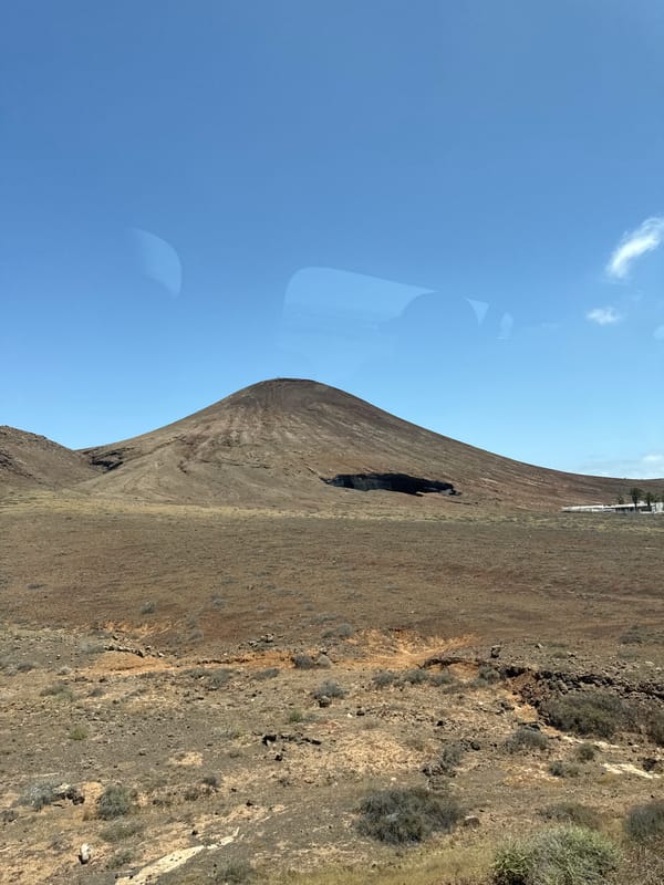 Volcanic cone with cave opening filmed in Arrecife