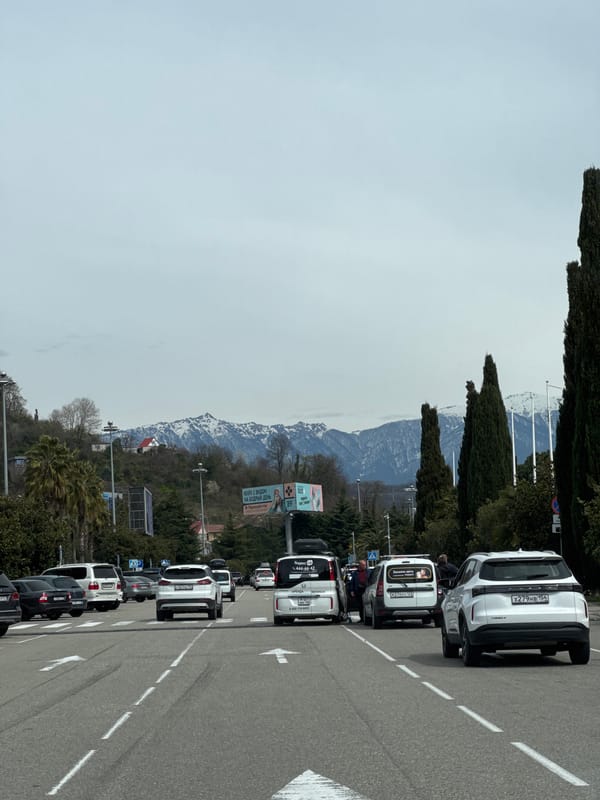 Cars parked along mountain road in Sochi, Russia