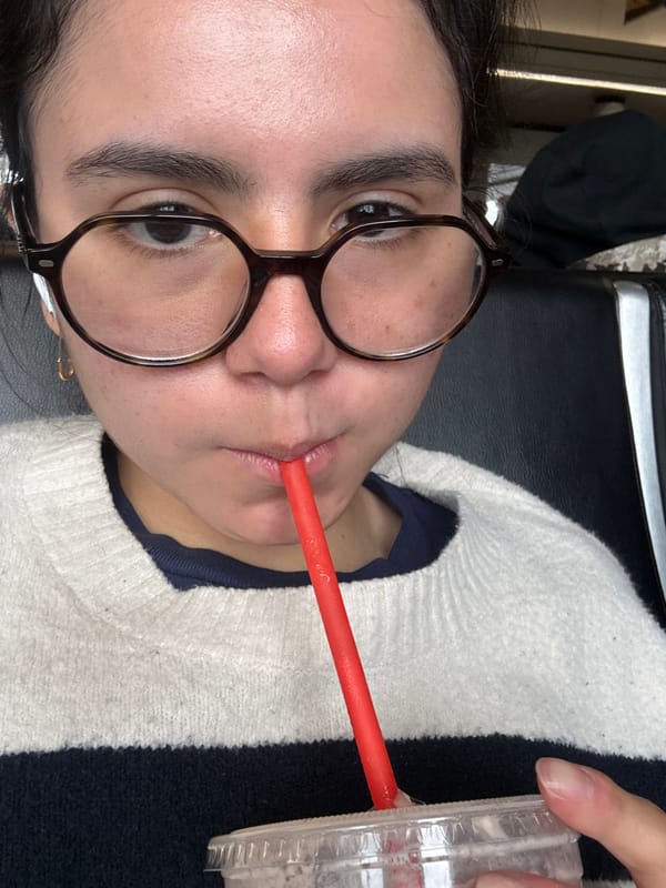 Woman enjoys beverage at Chicago airport terminal