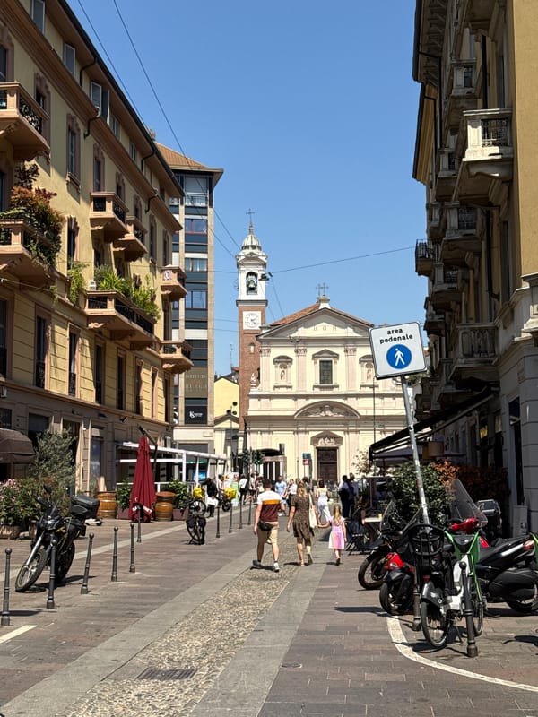 Daytime street scenes captured across Milan's mixed architecture