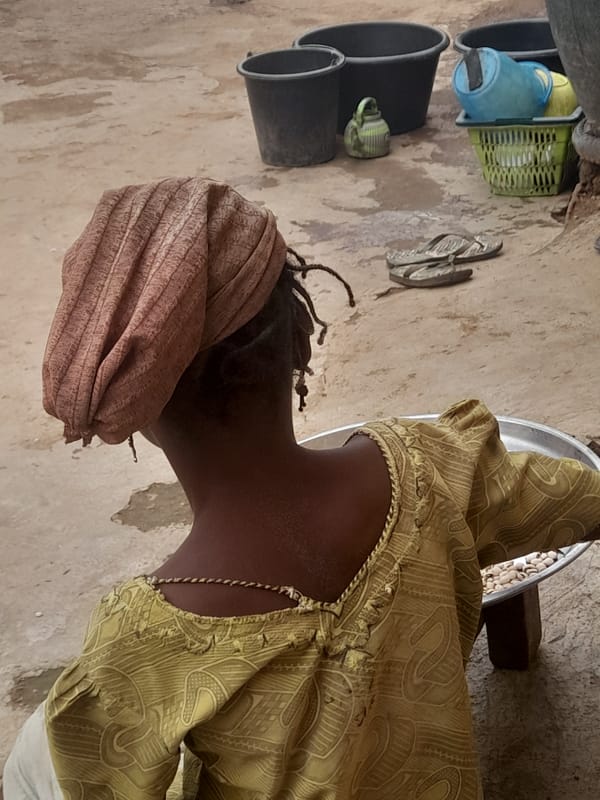 Children play, ride bicycles in Akwanga village streets