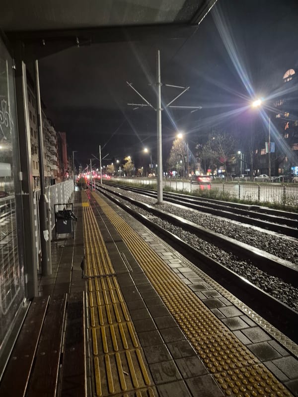 Nighttime train platform scene captured in Sofia, Bulgaria