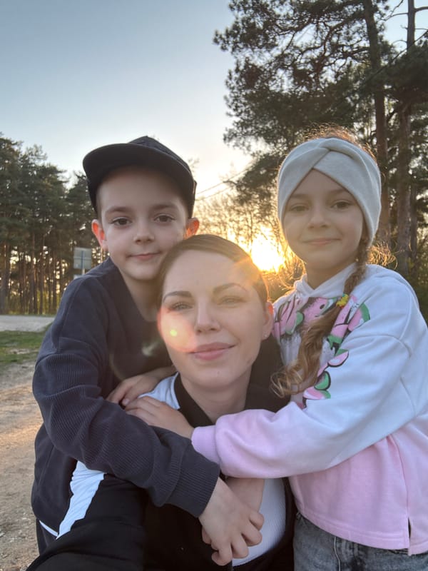Family enjoys afternoon playground visit in Раздолье, Russia