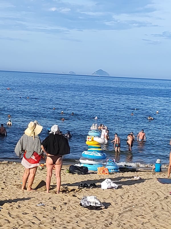 Nha Trang beach and city streets on a busy summer morning
