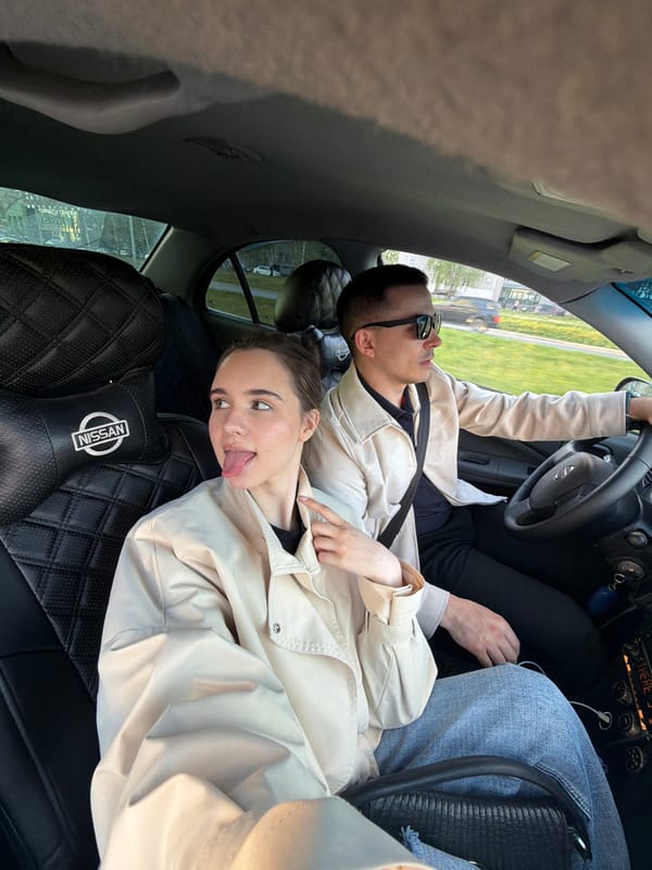 Couple photographed in casual moment inside car in Izhevsk