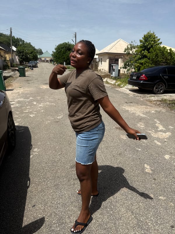 Residents document casual street activities in Abuja neighborhood