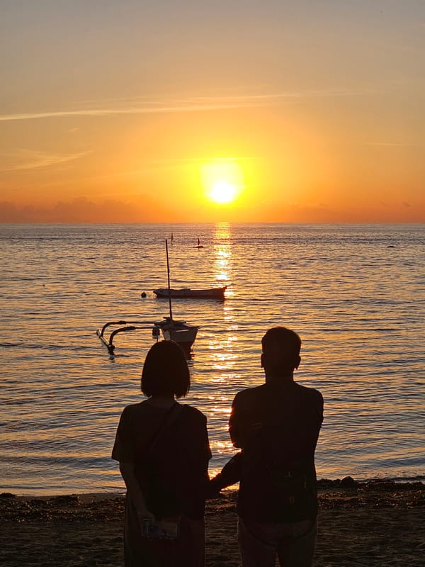Sunset photography and traditional boats captured at Denpasar beach