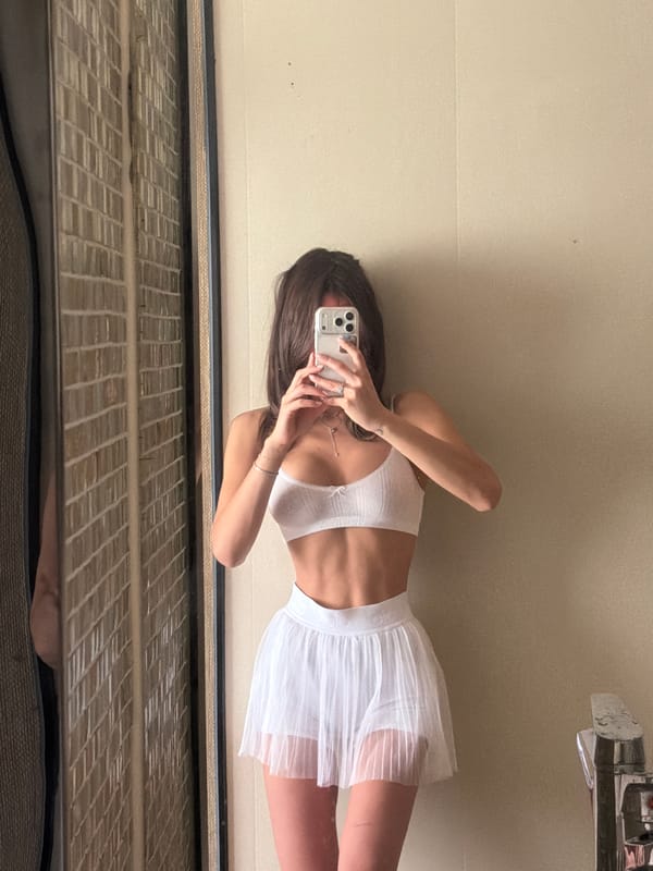 Woman styles hair in Shanghai hotel room early morning