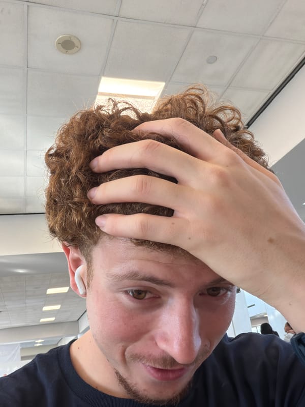 Man takes selfie with hand on head in Newark