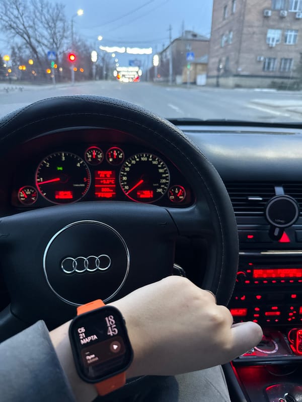 Driver navigates Audi through Makiivka streets at twilight