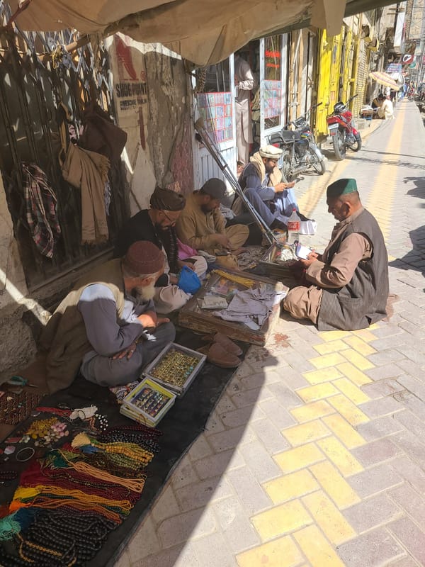 Street vendors conduct morning business in Quetta sidewalks