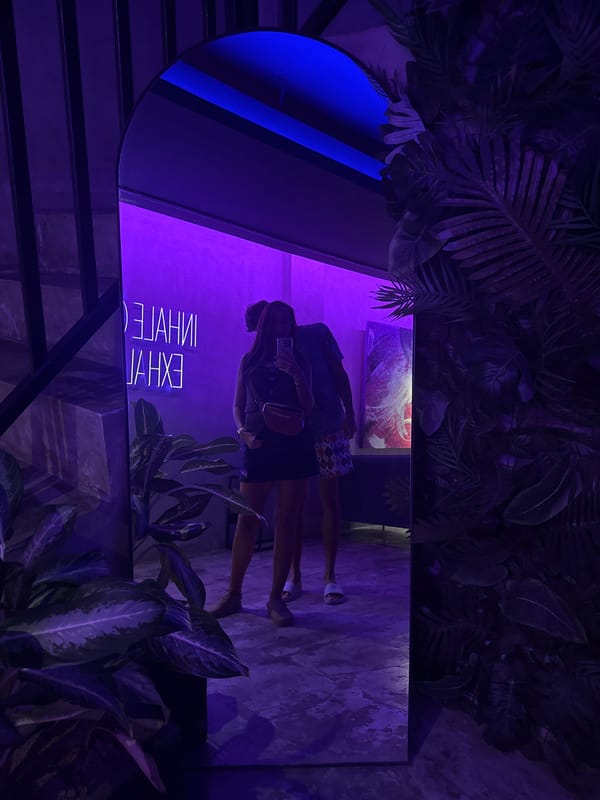 Indoor mirror photo captures two people in Indonesia