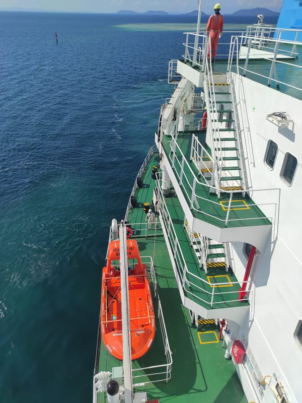 Large vessel docks at industrial pier in Kunak, Malaysia