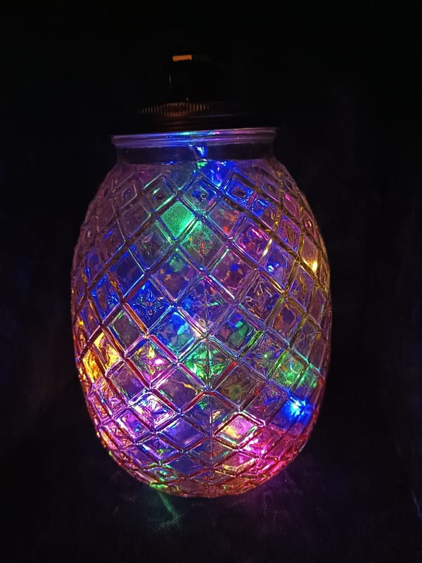 Decorative illuminated glass items displayed in Swiss collection