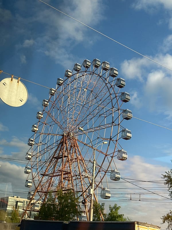 Ferris wheel observed operating in Novosibirsk under blue skies