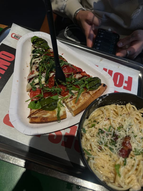 Customer enjoys pizza lunch at Yerevan restaurant