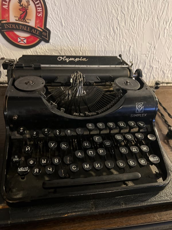 Vintage typewriter and pub scene documented in Saint Petersburg