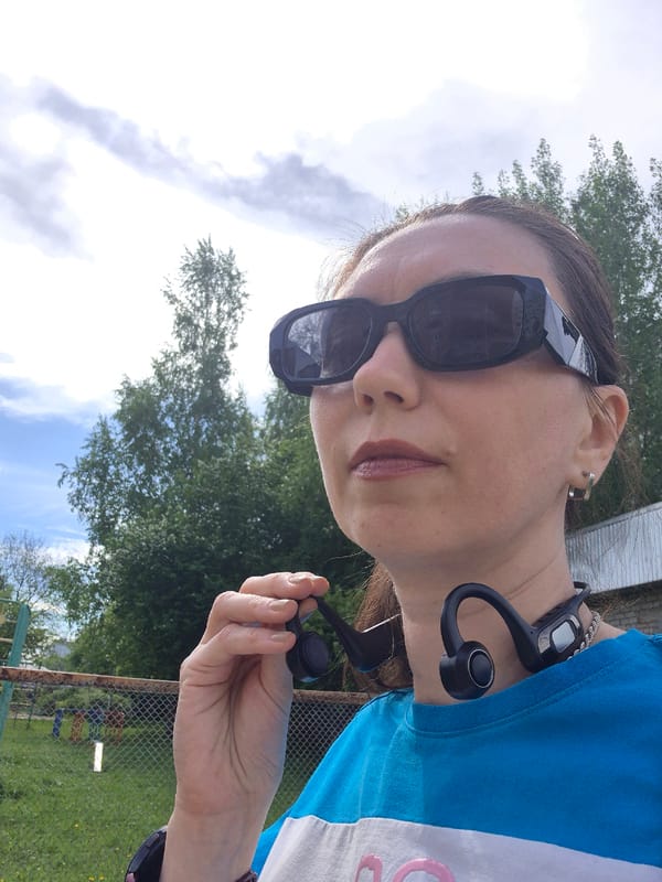 Woman with headphones spotted in urban outdoor setting