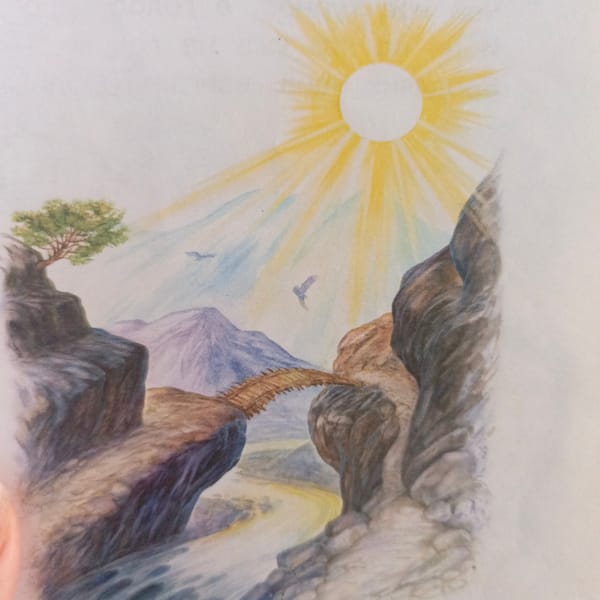 Toddler's mealtime documented alongside mountain landscape artwork