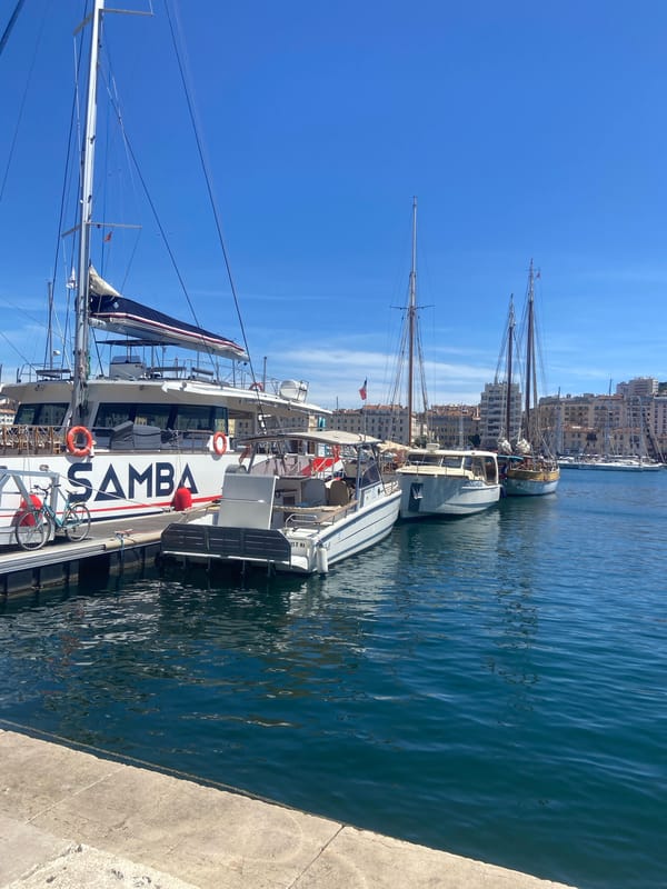 Marina boats and tiered fountain documented in afternoon scenes