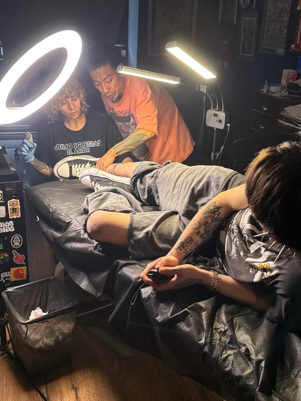 Early morning tattoo session documented in Tel Aviv studio