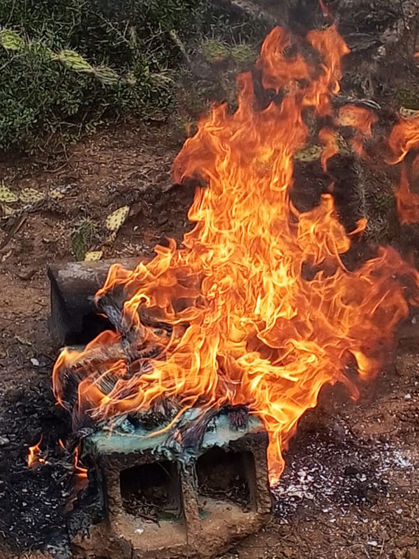 Fire burns around concrete block in Santa Ana, Venezuela