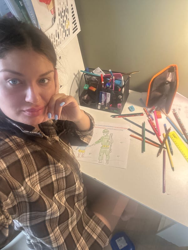 Woman takes selfie at art supply-filled desk in Khimki