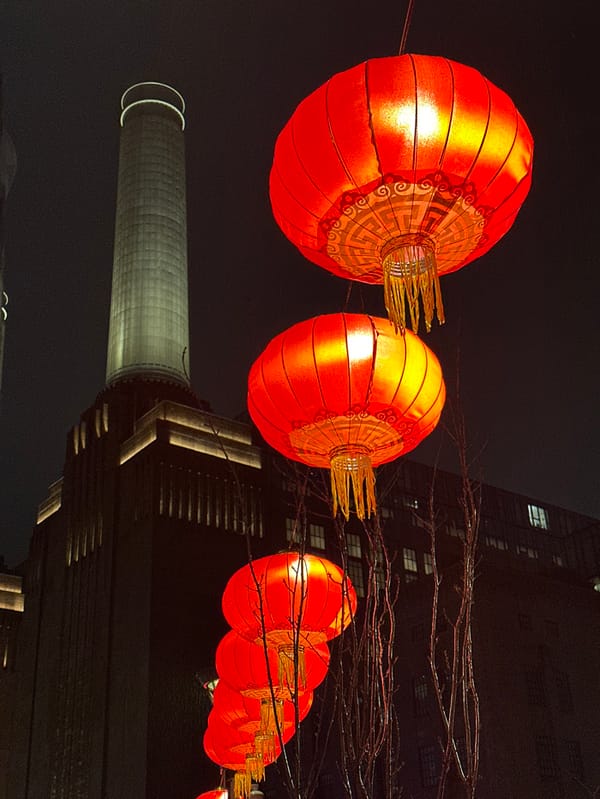 Red Chinese lanterns illuminate London night sky display